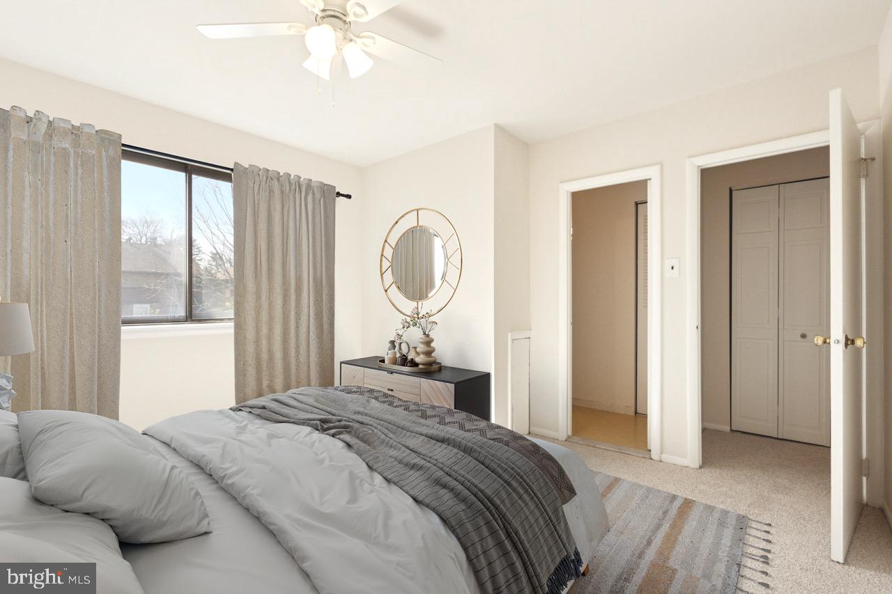 700 Ardmore Avenue, Unit 621 Ardmore, PA 19003 - Photo 23 of 37 a bedroom with a large bed and a chandelier