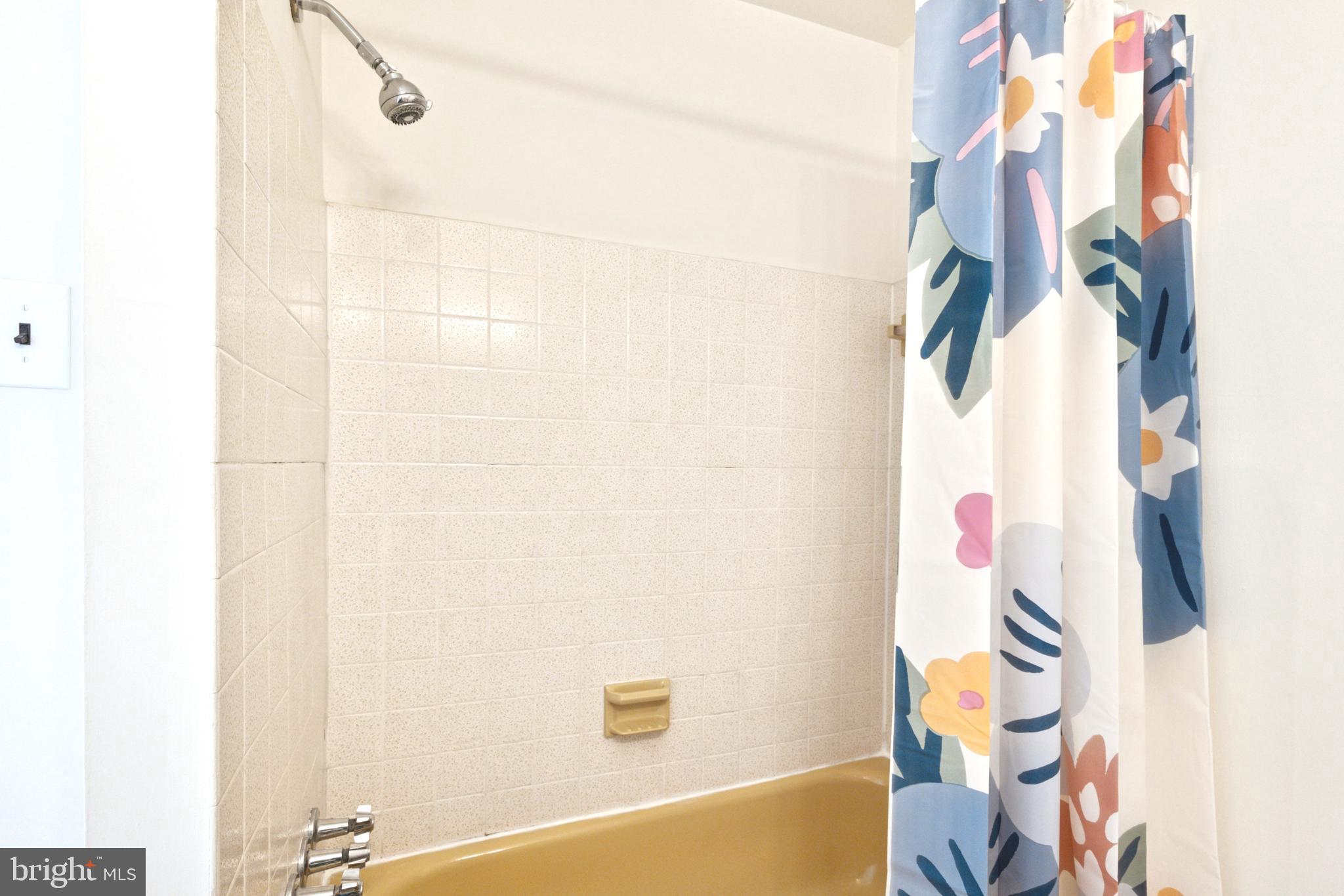 700 Ardmore Avenue, Unit 621 Ardmore, PA 19003 - Photo 26 of 37 a bathroom with a sink and a bathtub