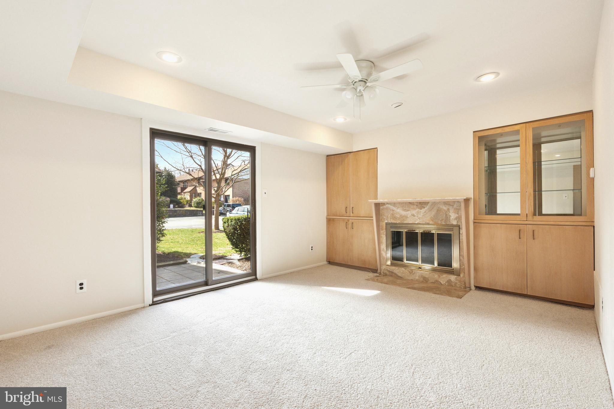 700 Ardmore Avenue, Unit 621 Ardmore, PA 19003 - Photo 4 of 37 a view of an empty room with a fireplace and a window
