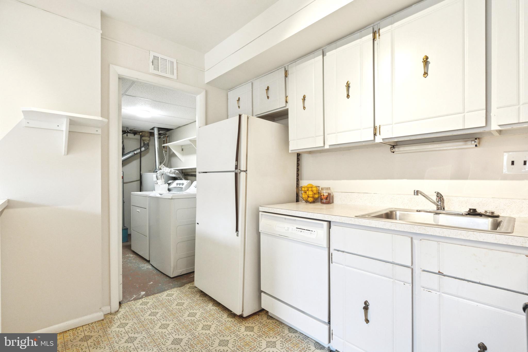 700 Ardmore Avenue, Unit 621 Ardmore, PA 19003 - Photo 10 of 37 a utility room with cabinets washer and dryer