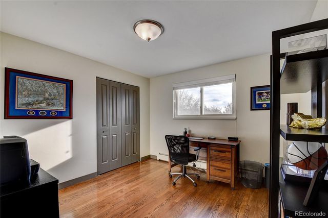 a workspace with furniture and wooden floor