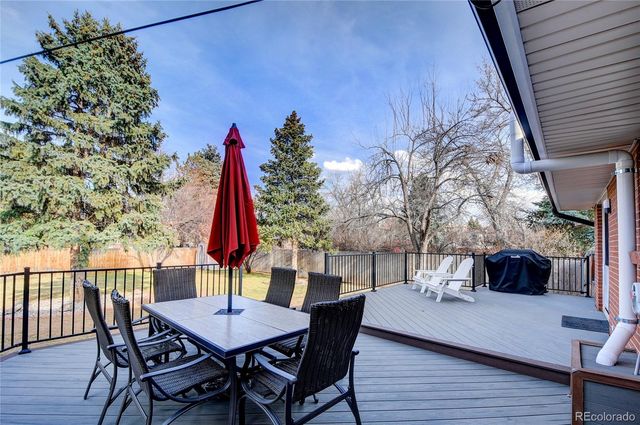 a view of a dining table and chairs in the patio