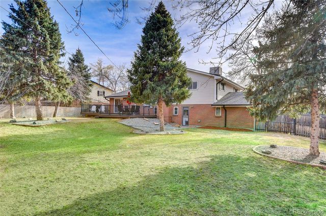 a house view with a sitting space and garden