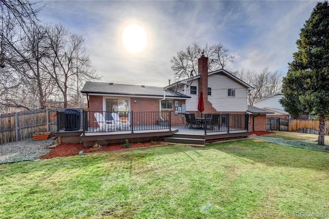 a view of a house with a yard porch and sitting area