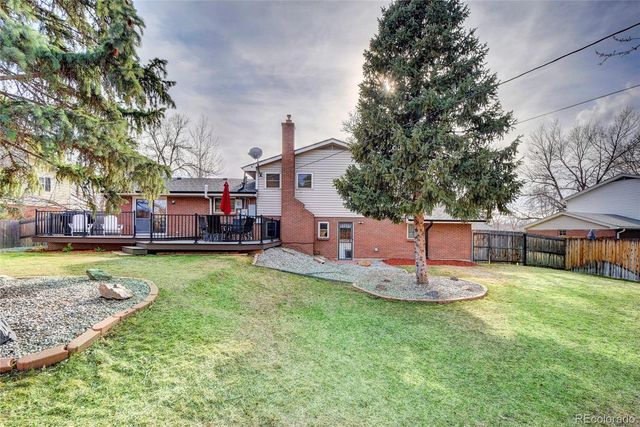 a house view with a sitting space and garden