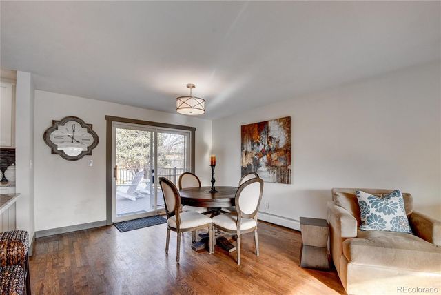 a view of a livingroom with furniture window and wooden floor