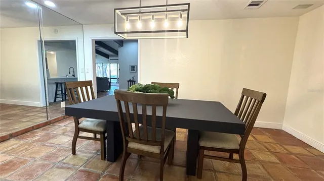 a bedroom with a bed and a view of en suite bathroom