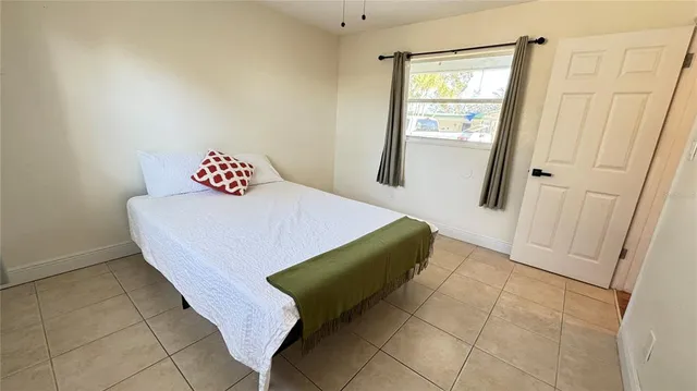 a bedroom with a bed and a table