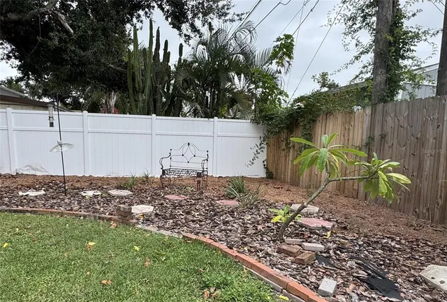 a view of a house with a yard and plants