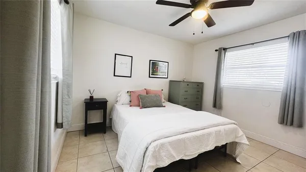 a spacious bathroom with a double vanity sink mirror and toilet
