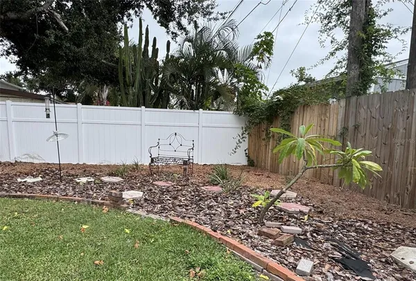 a view of a house with a yard and plants