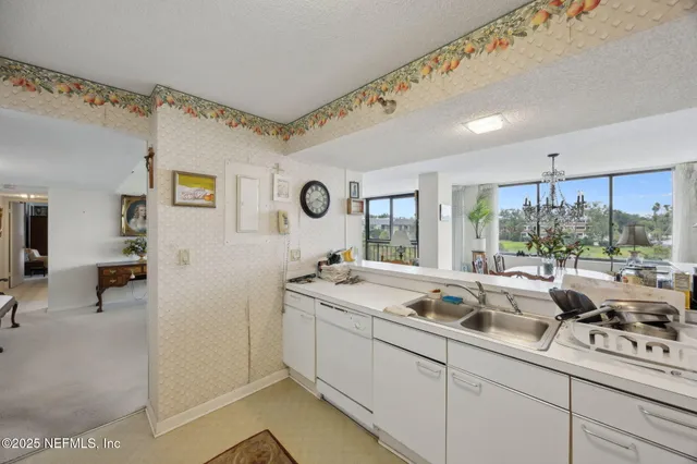 a kitchen with a sink and a window