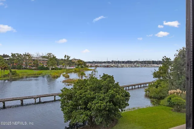a view of a lake with outdoor space and yard