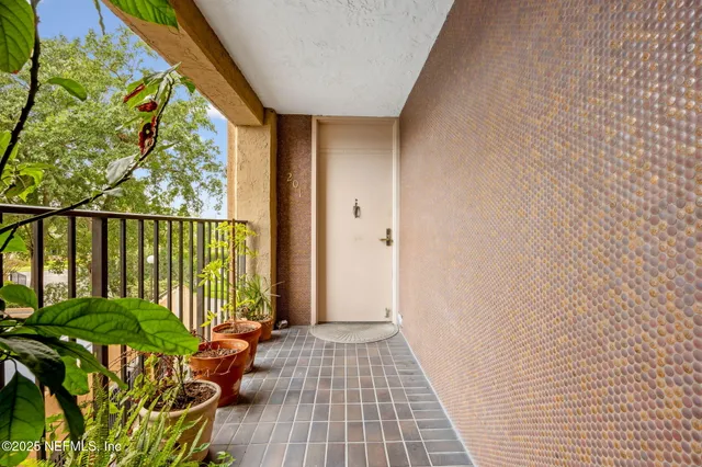 a view of a balcony with wooden floor