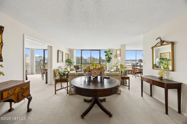 a living room with furniture and a table