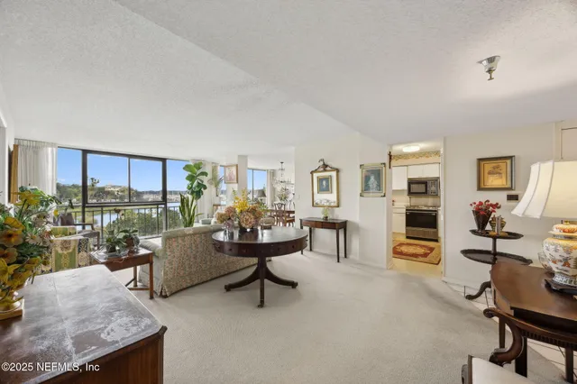 a living room with furniture and a table