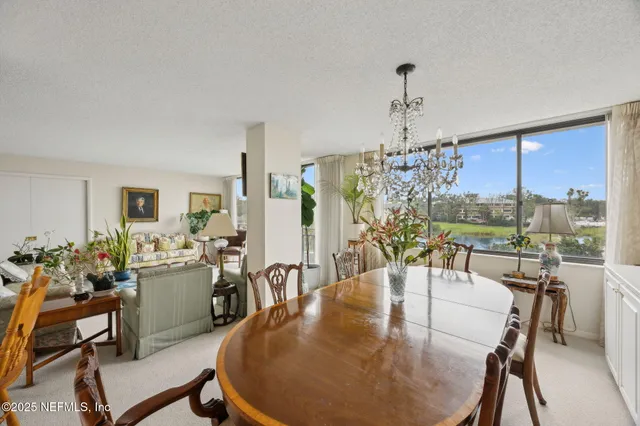 a view of a dining room with furniture window and outside view