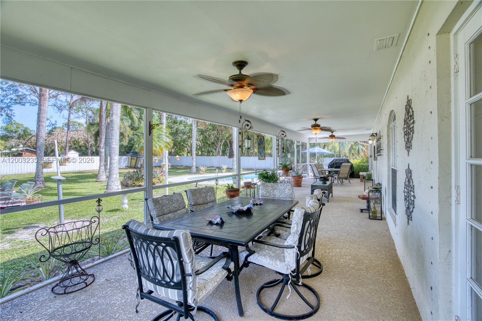 16078 Mellen Lane Jupiter, FL 33478 - Photo 33 of 57 a view of a dining room with furniture window and outside view