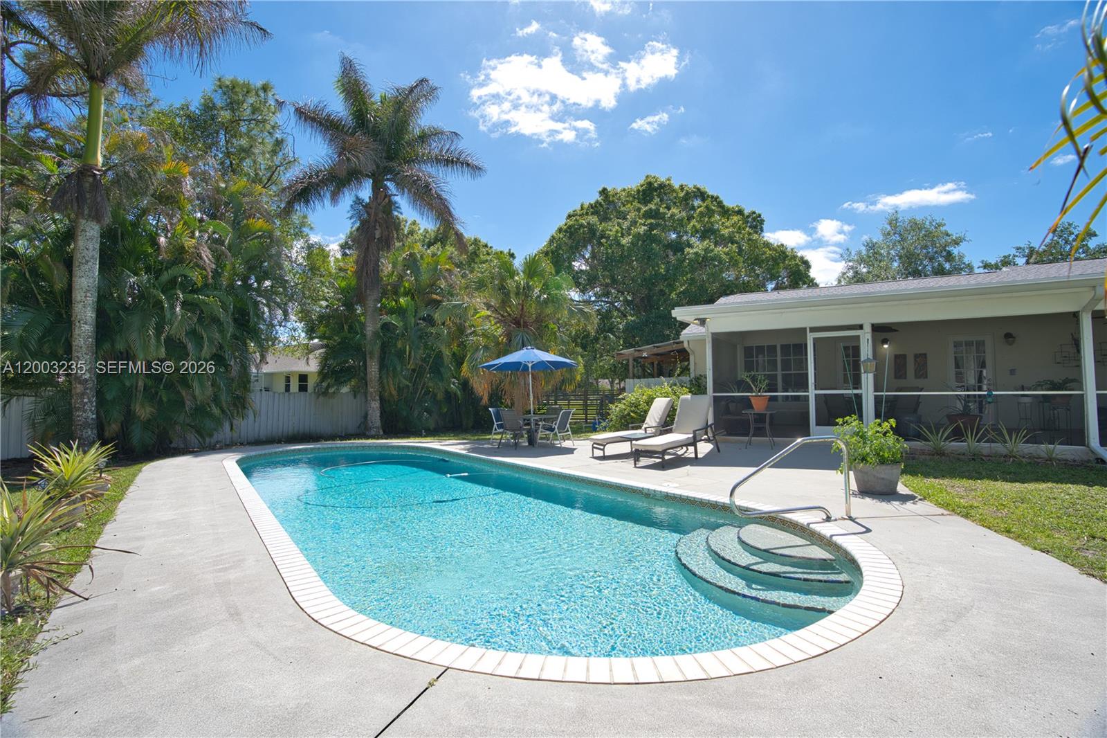 16078 Mellen Lane Jupiter, FL 33478 - Photo 4 of 57 a view of a house with swimming pool and sitting area