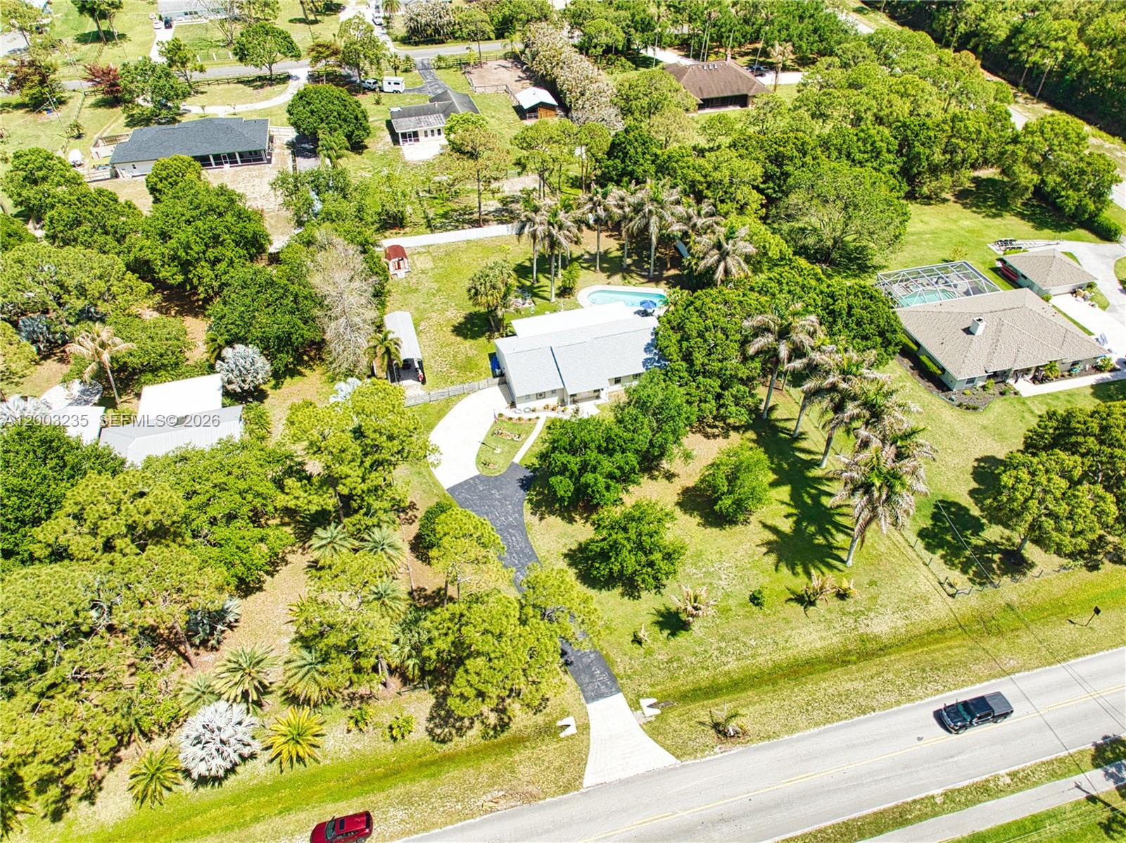 16078 Mellen Lane Jupiter, FL 33478 - Photo 54 of 57 an aerial view of a residential houses with yard