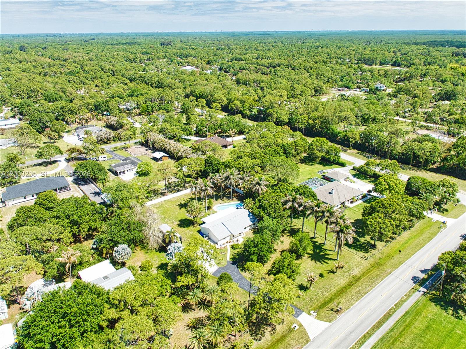 16078 Mellen Lane Jupiter, FL 33478 - Photo 55 of 57 a view of a garden with a tree