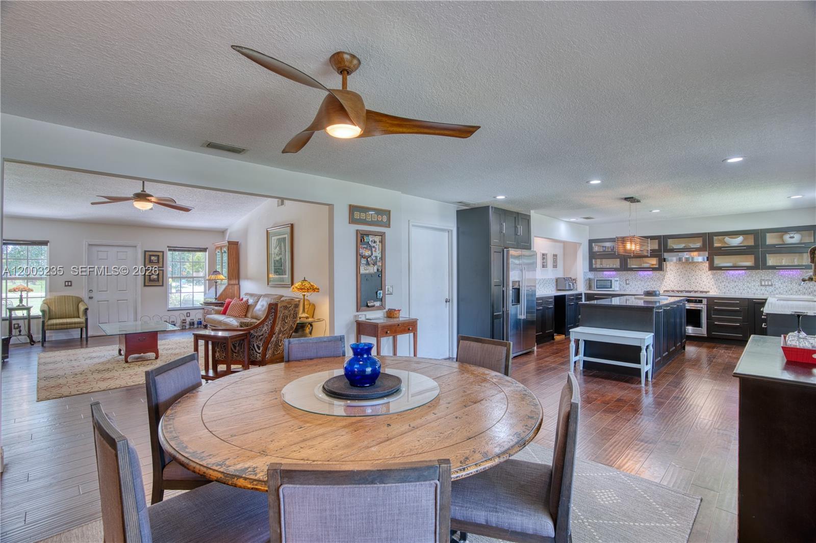 16078 Mellen Lane Jupiter, FL 33478 - Photo 10 of 57 a view of a dining room with furniture