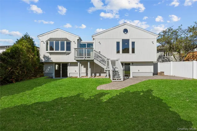 a view of house with backyard