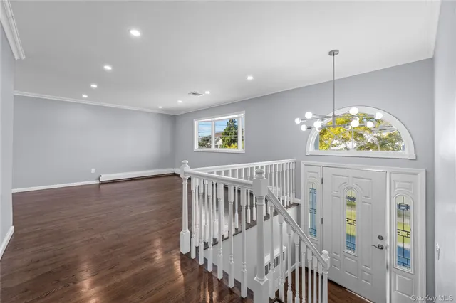 a view of entryway with wooden floor