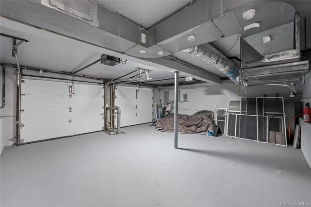 a view of a hallway with wooden shelves