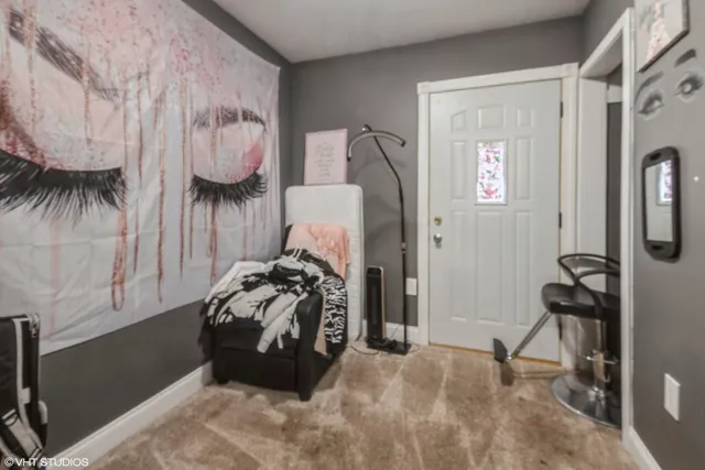 a bed room with a bed and a chair