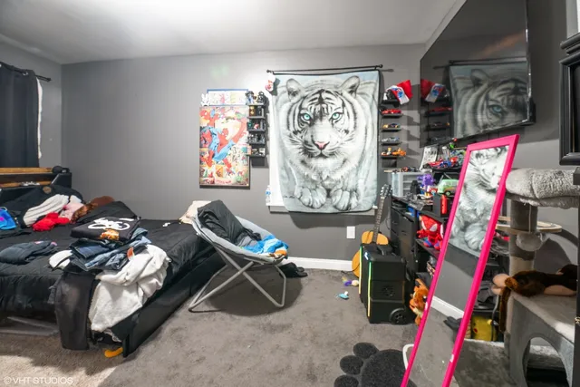 a bedroom with furniture and a bed