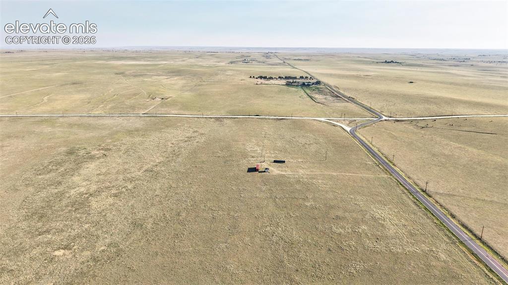 9670 Boone Road Yoder, CO 80864 - Photo 7 of 18 Expansive rural acreage with intersecting roads and distant structures, offering vast open land