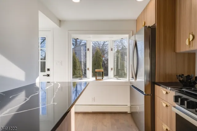 a view of a kitchen with a large window