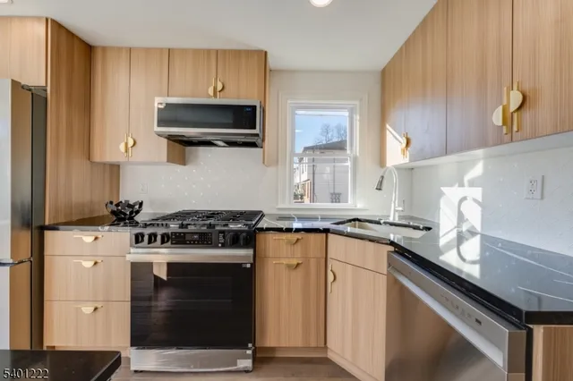 a kitchen with a stove and a sink