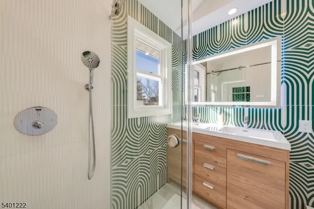 a view of a hallway with a dining area wooden floor and a rug