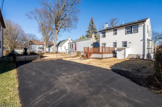 a view of a house with a snow in the yard