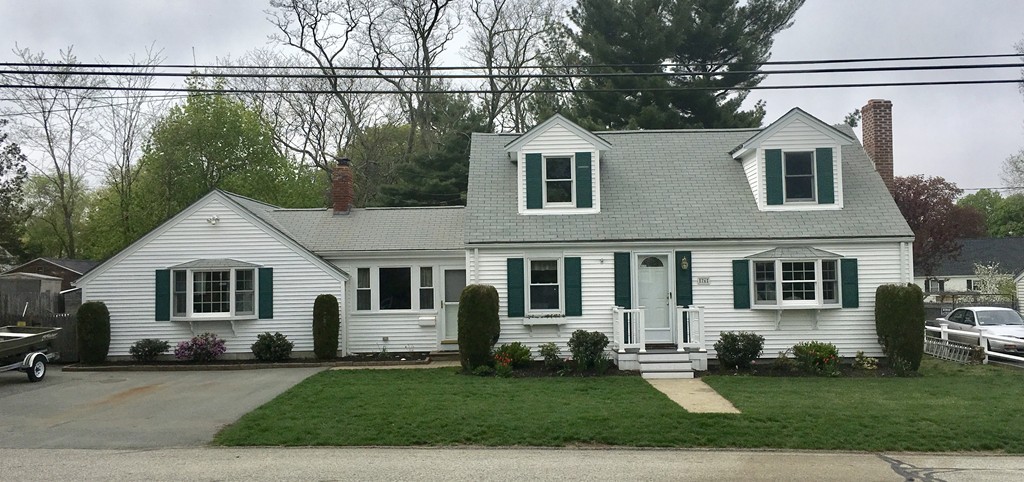 a front view of a house with a yard