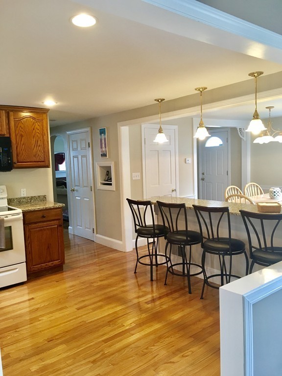 76 Rinaldo Road Weymouth, MA 02191 - Photo 4 of 23 a large kitchen with a table and chairs in it