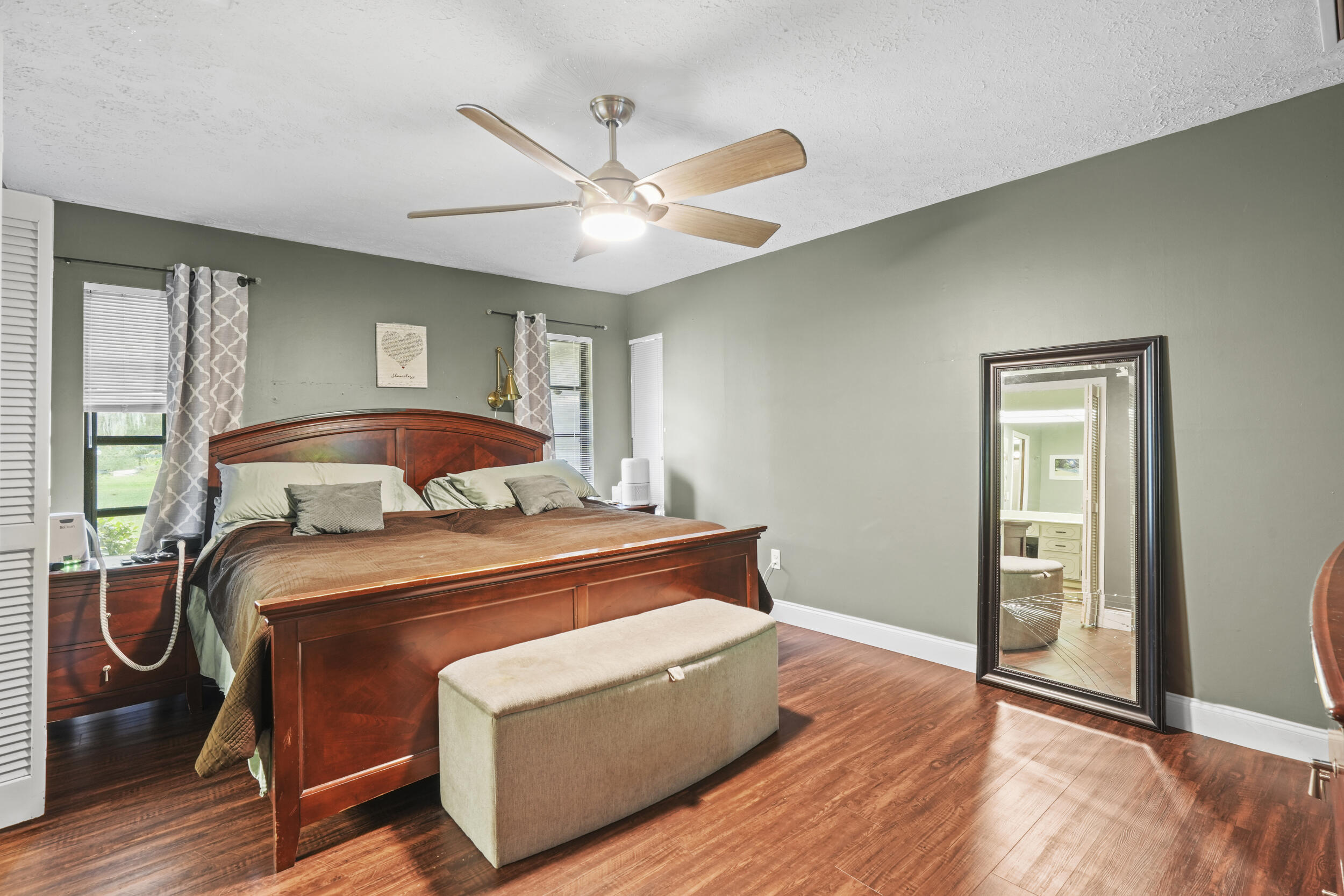 4170 McCarty Road Fort Pierce, FL 34945 - Photo 31 of 57 a bedroom with a bed and window