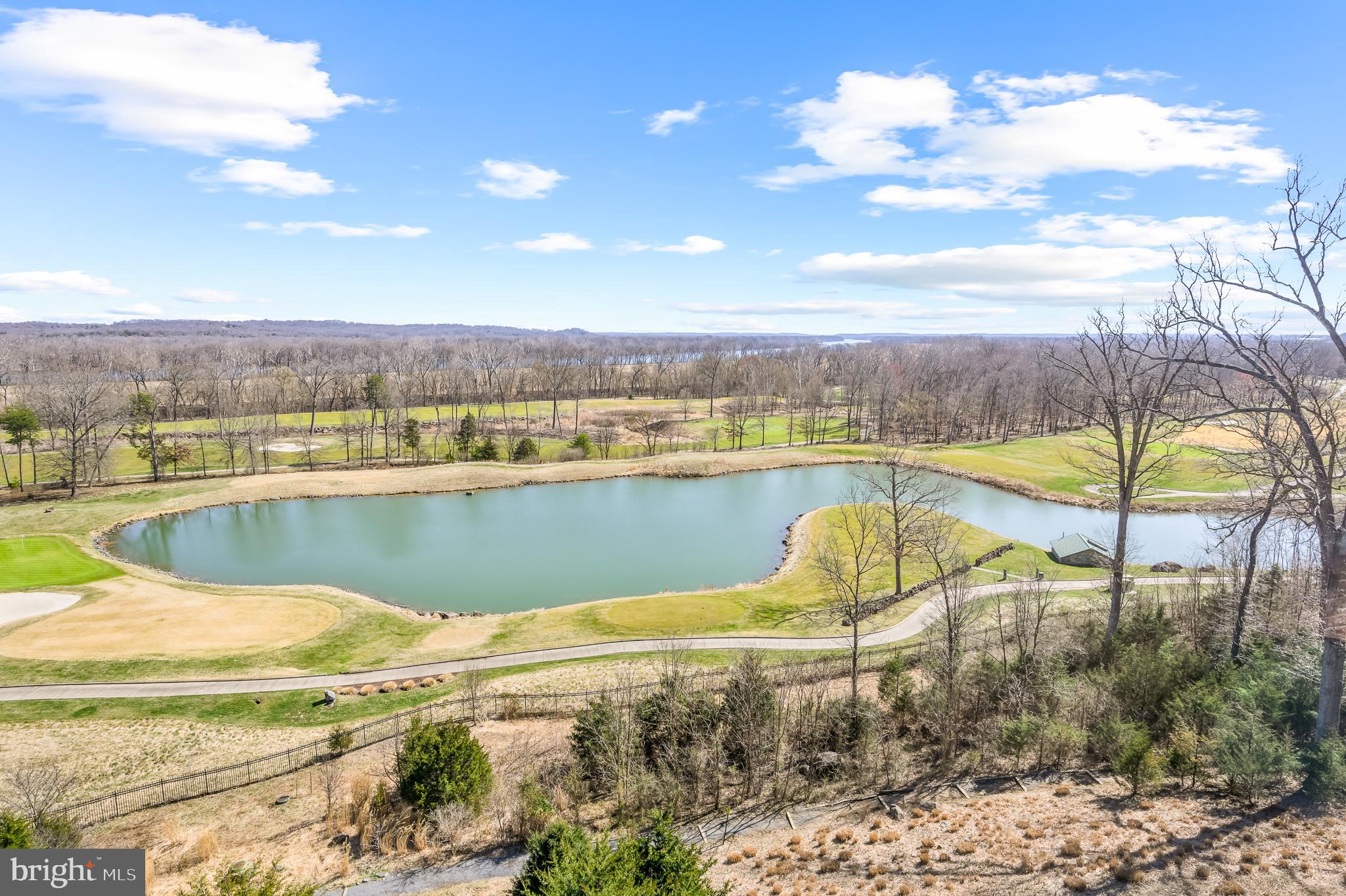 19360 Magnolia Grove Square, Unit 418 Leesburg, VA 20176 - Photo 1 of 25 a view of a lake with a outdoor space