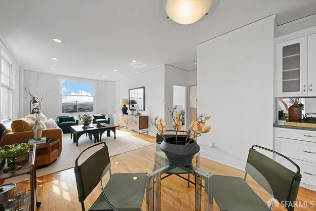 a view of a dining room with furniture and wooden floor