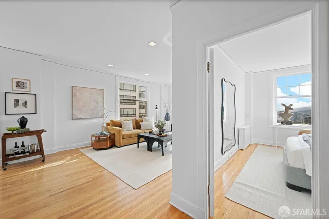 a bedroom with a bed and a couch