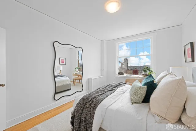 a bedroom with a bed and a chair