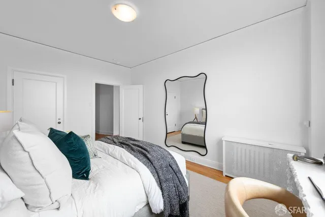 a bedroom with a bed and a couch