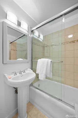 a spacious bedroom with a bed and window