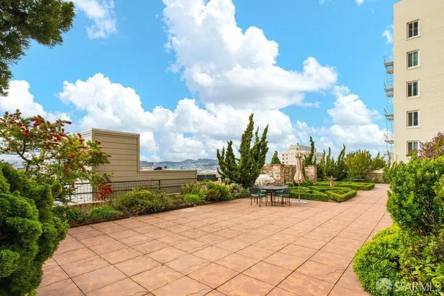 a view of an outdoor space with lounge chair