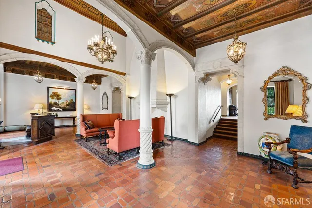 a living room with furniture rug and window