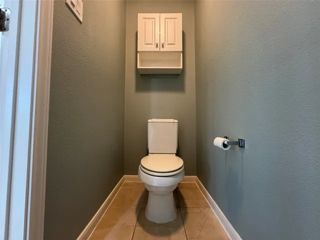 a bathroom with a toilet and a sink