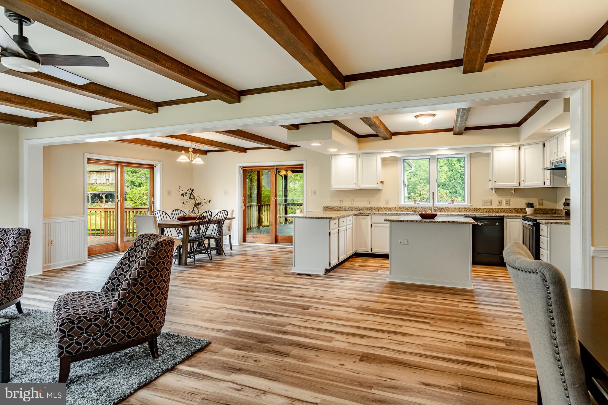 249 Mattson Road Garnet Valley, PA 19060 - Photo 16 of 53 a large white kitchen with wooden floors and stainless steel appliances