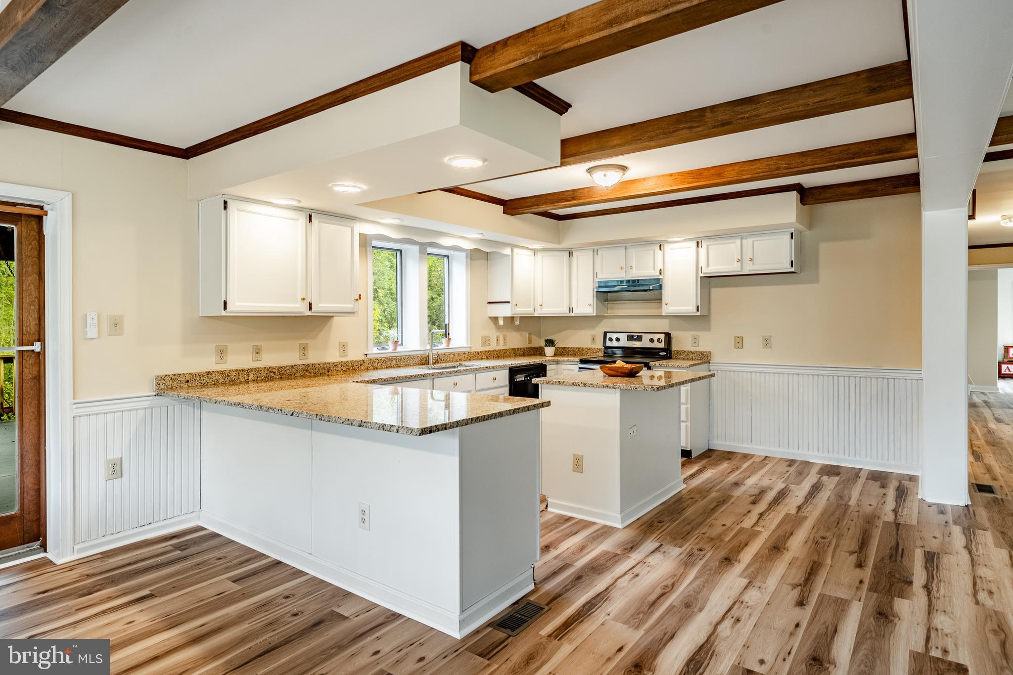 249 Mattson Road Garnet Valley, PA 19060 - Photo 17 of 53 a kitchen with granite countertop cabinets stainless steel appliances a sink and a counter top space